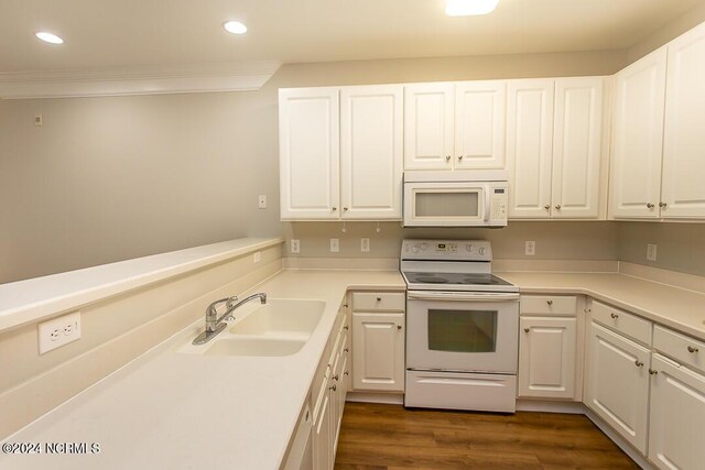 kitchen featuring sink, white cabinetry, white appliances, and dark hardwood / wood-style floors