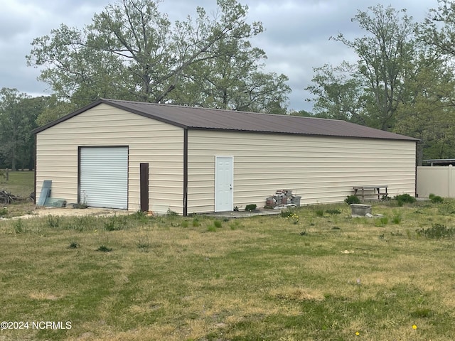 garage featuring a yard