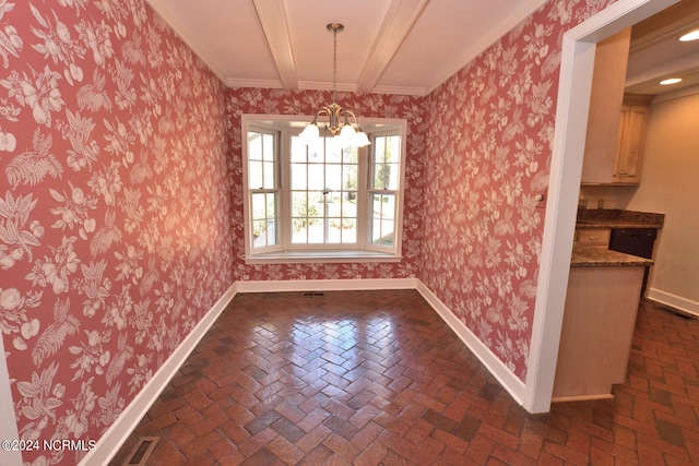 spare room featuring a notable chandelier