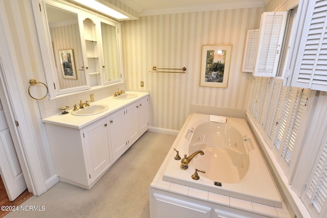 bathroom featuring ornamental molding, dual bowl vanity, and a bathtub