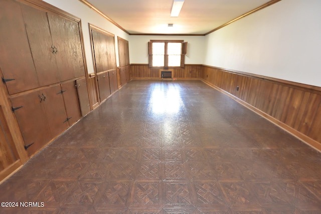 empty room with dark parquet floors and ornamental molding