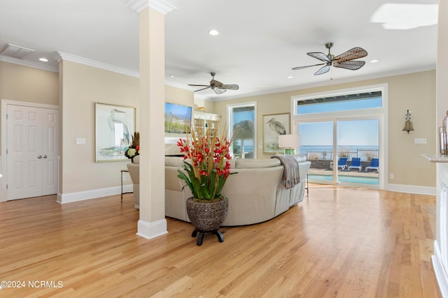 living room with light hardwood / wood-style floors, ceiling fan, and ornamental molding