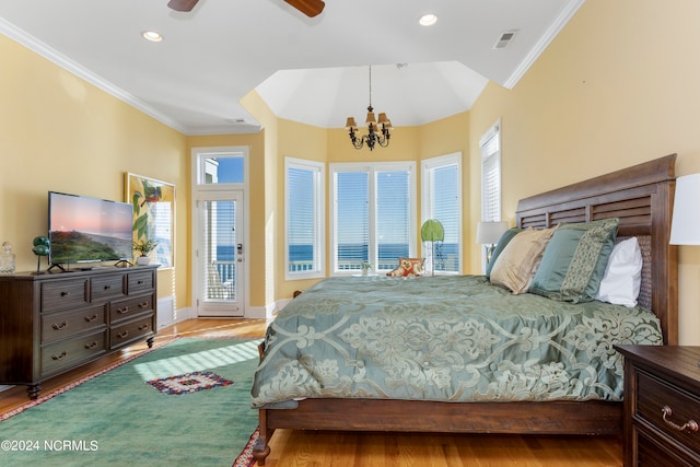 bedroom with crown molding, ceiling fan with notable chandelier, light hardwood / wood-style floors, and access to outside