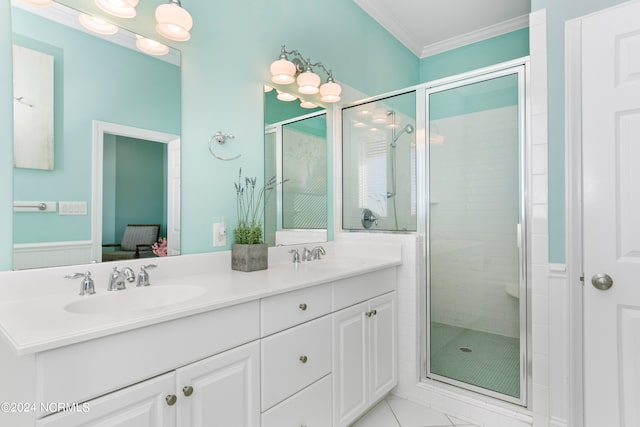 bathroom with crown molding, tile flooring, an enclosed shower, and double vanity