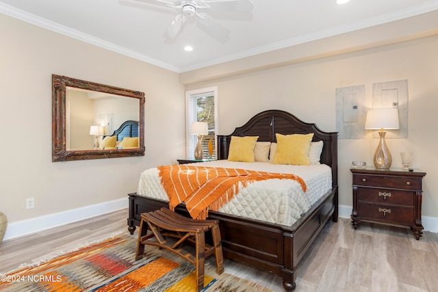 bedroom featuring ceiling fan, ornamental molding, and light hardwood / wood-style floors