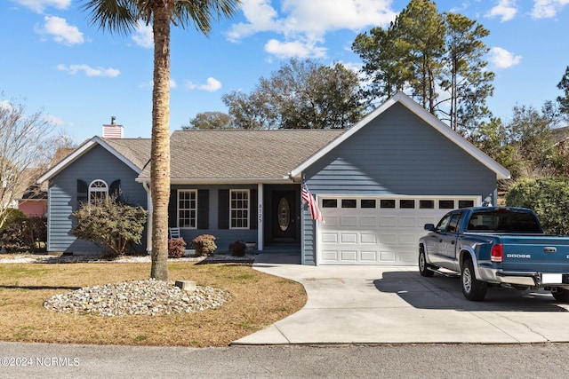 ranch-style home with a front lawn and a garage