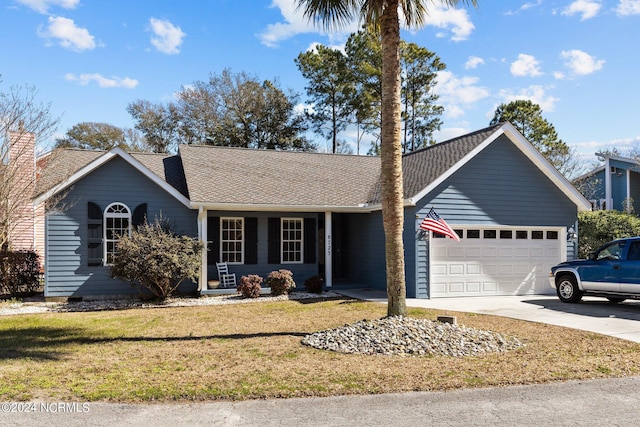 ranch-style home featuring a front lawn and a garage