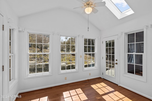 unfurnished sunroom with lofted ceiling with skylight and ceiling fan