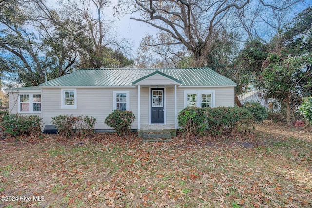 ranch-style home with a front lawn