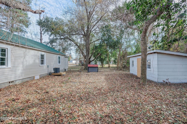 view of yard with central AC unit