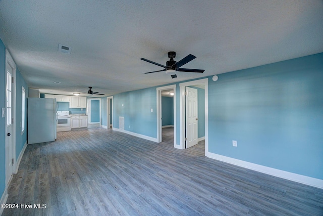 unfurnished living room with a textured ceiling, hardwood / wood-style flooring, and ceiling fan