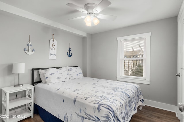 bedroom with ceiling fan and dark wood-type flooring