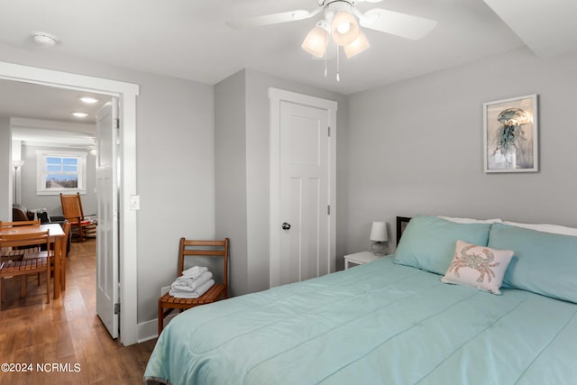 bedroom featuring ceiling fan and hardwood / wood-style flooring