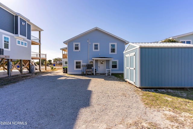 view of front facade featuring a shed