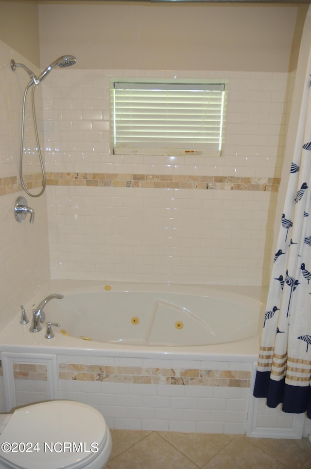 bathroom featuring tile flooring and toilet