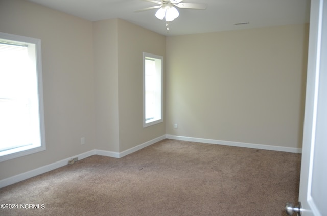 carpeted empty room with ceiling fan