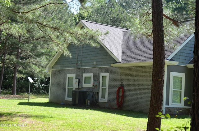 back of house with a yard