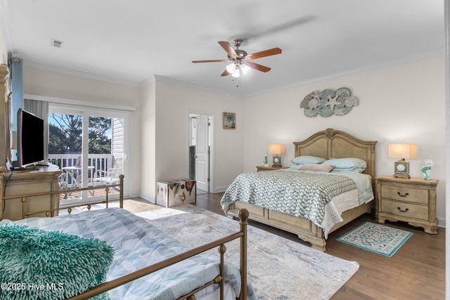 bedroom with visible vents, crown molding, wood finished floors, baseboards, and access to outside