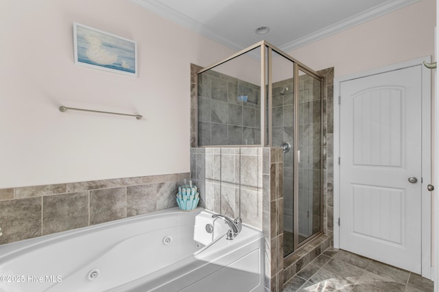bathroom featuring crown molding, a tub with jets, and a stall shower