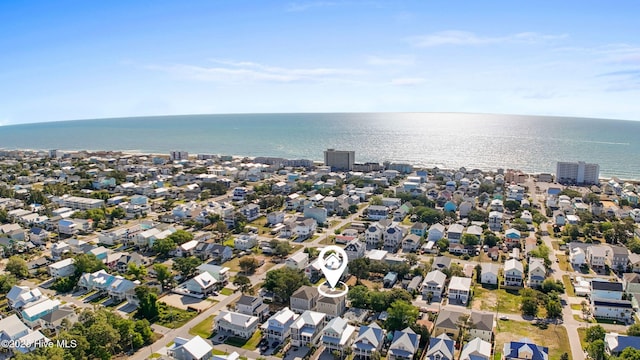 drone / aerial view with a water view and a residential view