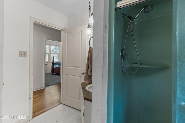 bathroom with vanity and hardwood / wood-style flooring