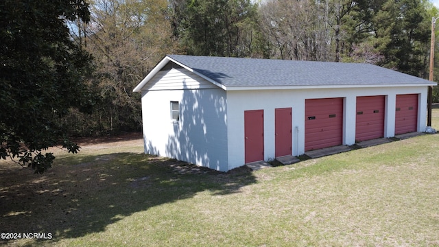 garage featuring a yard