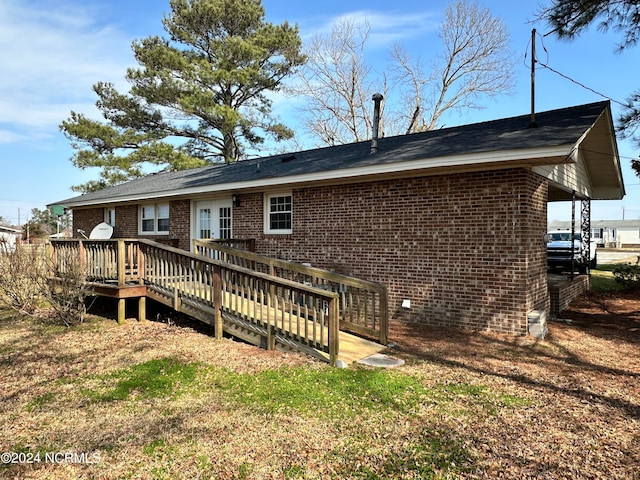 rear view of property with a deck