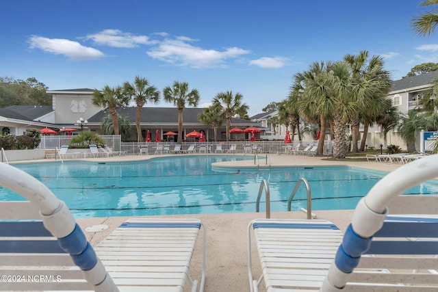 view of swimming pool featuring a patio area