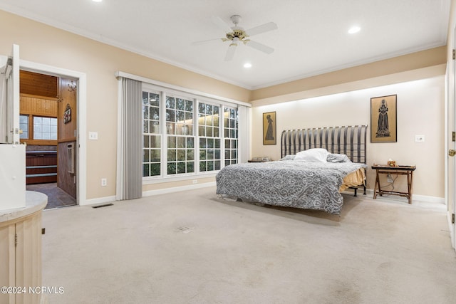 carpeted bedroom with ornamental molding, multiple windows, and ceiling fan