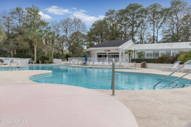 view of pool featuring a patio