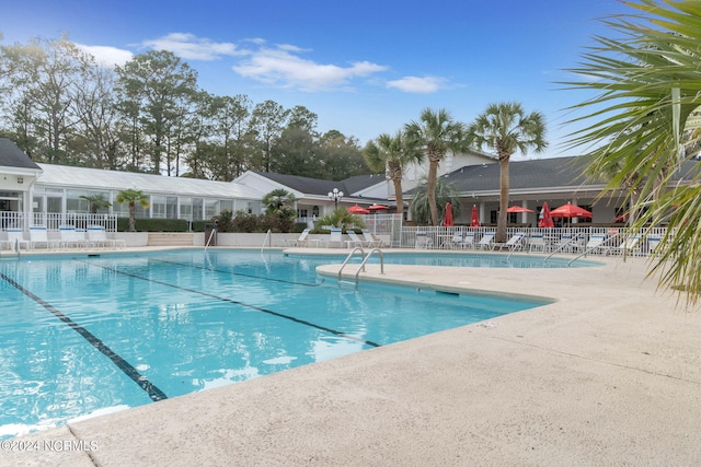 view of swimming pool featuring a patio