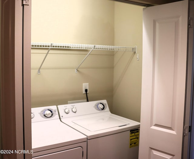 washroom featuring washer and clothes dryer