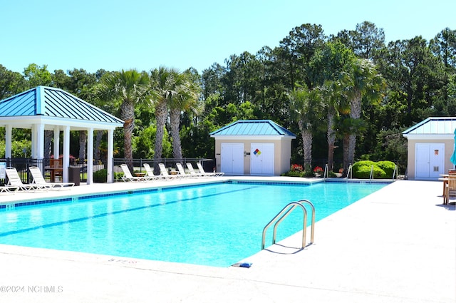 view of swimming pool with a gazebo and a patio area