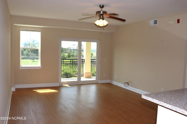 spare room with ceiling fan and hardwood / wood-style flooring