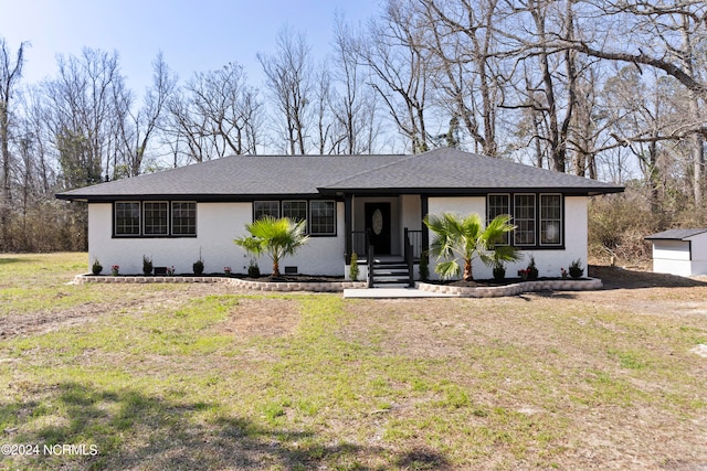 ranch-style house with a front yard