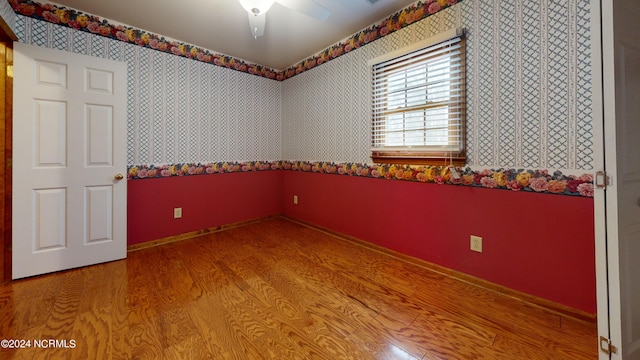 empty room with light hardwood / wood-style floors and ceiling fan