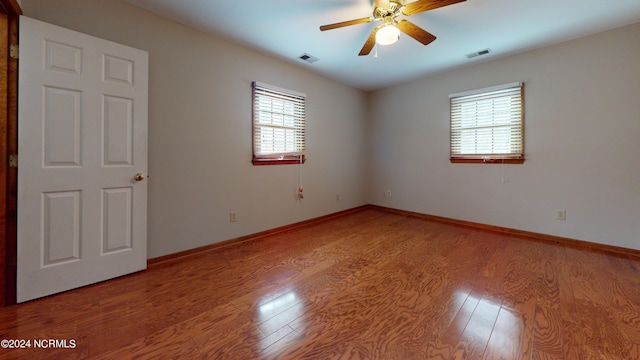 unfurnished room featuring light hardwood / wood-style floors and ceiling fan