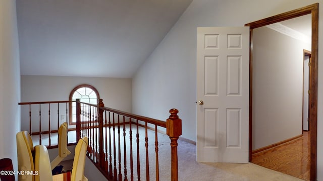 interior space featuring lofted ceiling and light wood-type flooring