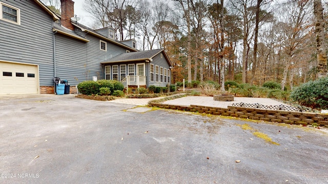 view of property exterior with a garage