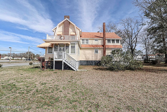 back of house featuring a porch