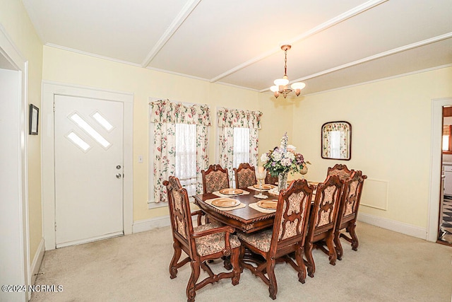 dining room with an inviting chandelier and light carpet