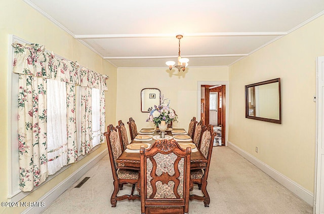 dining space featuring a chandelier and light colored carpet