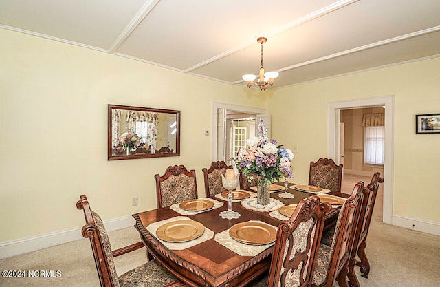 carpeted dining room featuring a chandelier