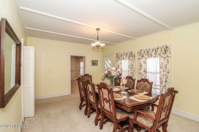 dining space with light carpet and a chandelier