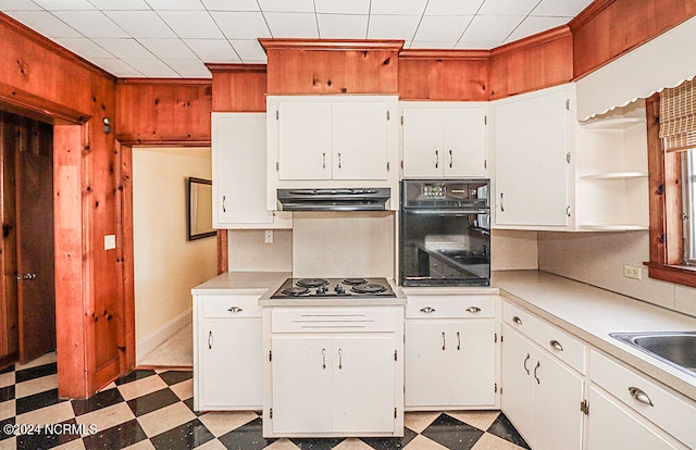 kitchen with black oven, white cabinetry, ventilation hood, stainless steel gas stovetop, and light tile flooring