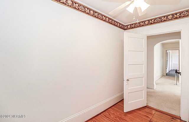 empty room with light hardwood / wood-style floors and ceiling fan