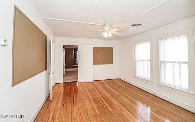 empty room with ceiling fan and light wood-type flooring