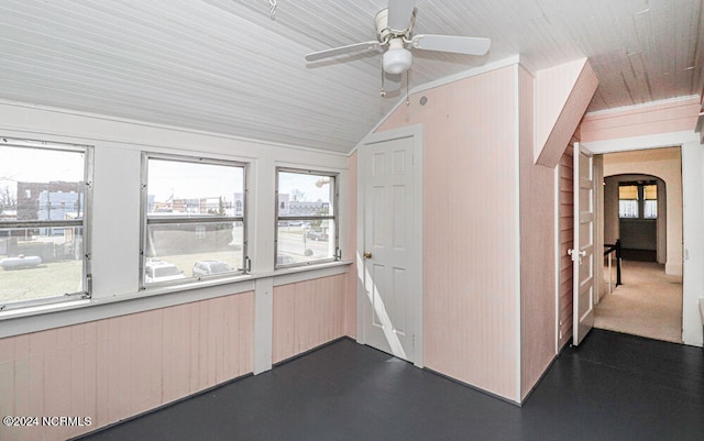 interior space featuring ceiling fan and vaulted ceiling