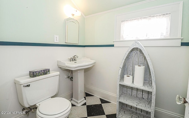 bathroom featuring toilet, tile floors, sink, and crown molding