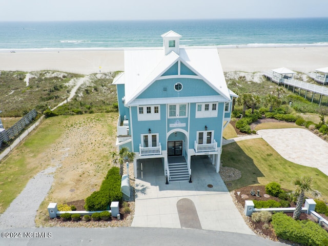 bird's eye view featuring a view of the beach and a water view